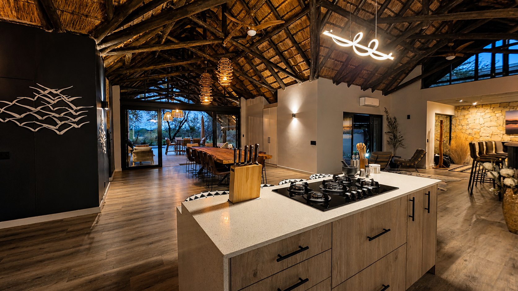 The long kitchen island running straight into the lounge.